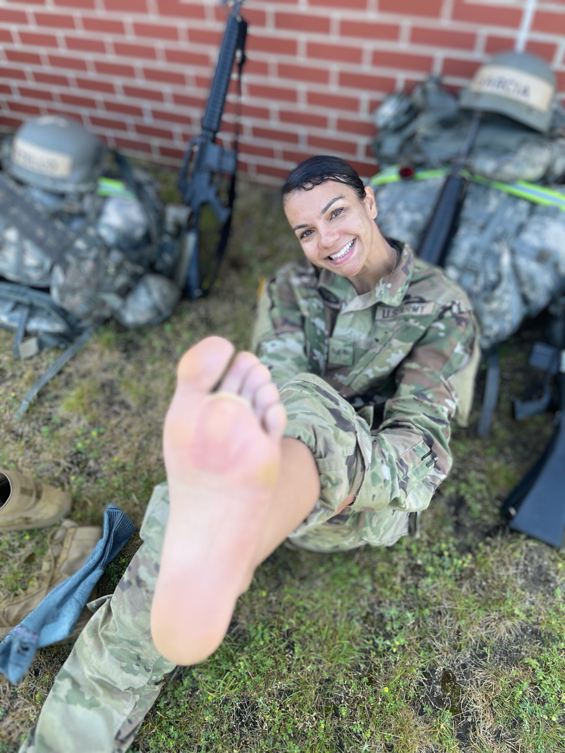 Rebeca Elizabeth during military training — resilience, humor, and human moments behind her business journey