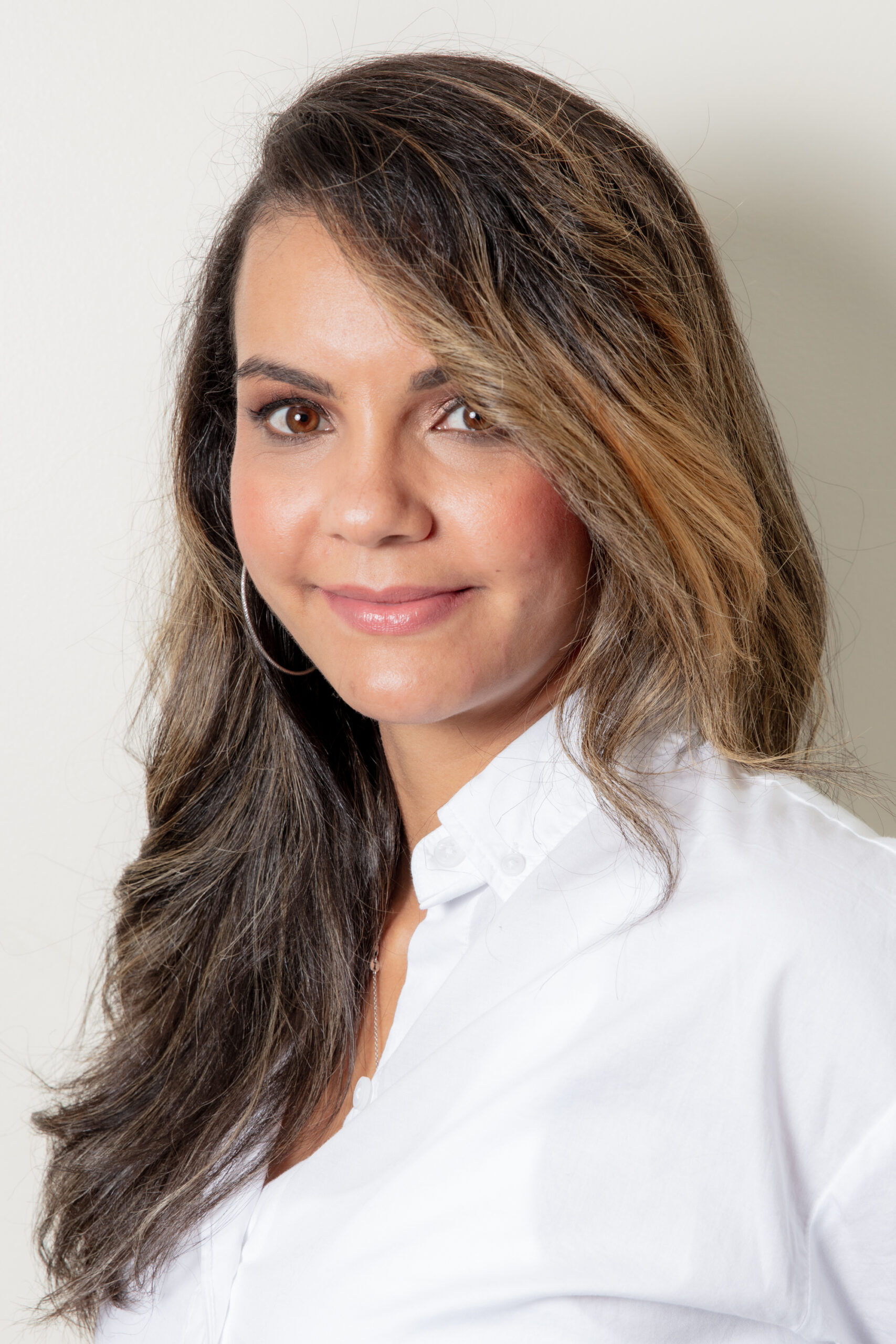 Rebeca Elizabeth smiling — founder of Rebeca’s Beautiful Enterprise helping entrepreneurs rebuild structure and peace